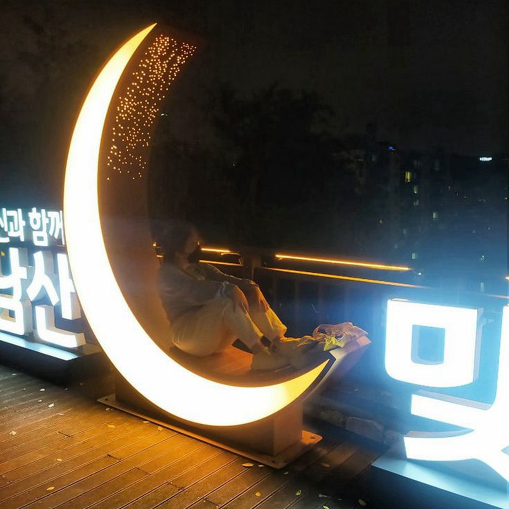 lighting moon sculpture at night