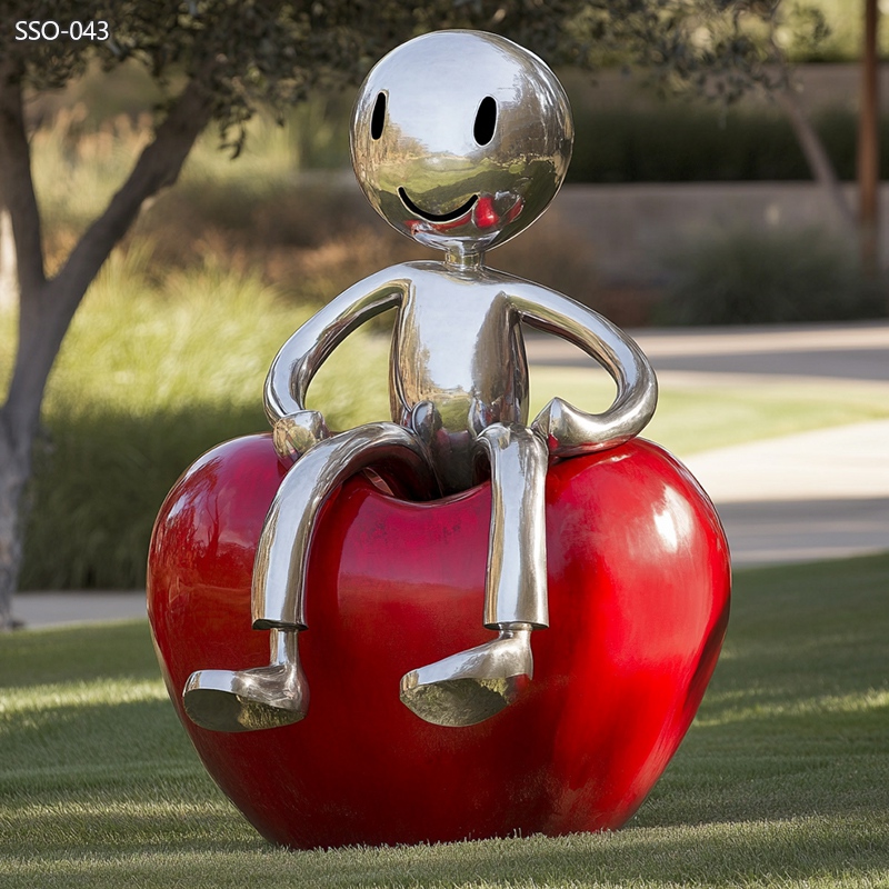 modern stainless steel fun red apple people sculpture